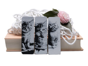 3 cute cuddly kittens on 3D printed bookmarks.