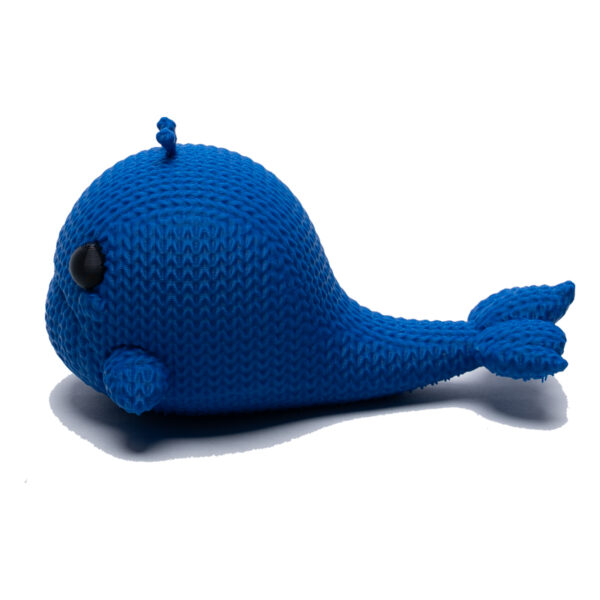 Sad blue knitted whale toy in profile. He floats!