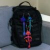 Backpack shown with clip on dragons
